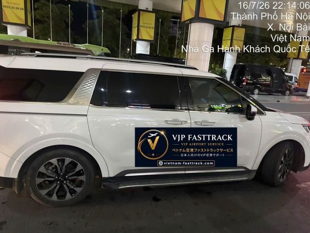 VJP FASTTRACK guiding a Noi Bai Executive Arrival passenger to a private 7-seat Limousine at Hanoi Noi Bai Airport